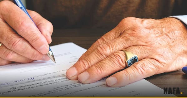 Main signant un document financier, illustration symbolique d'une émission obligataire